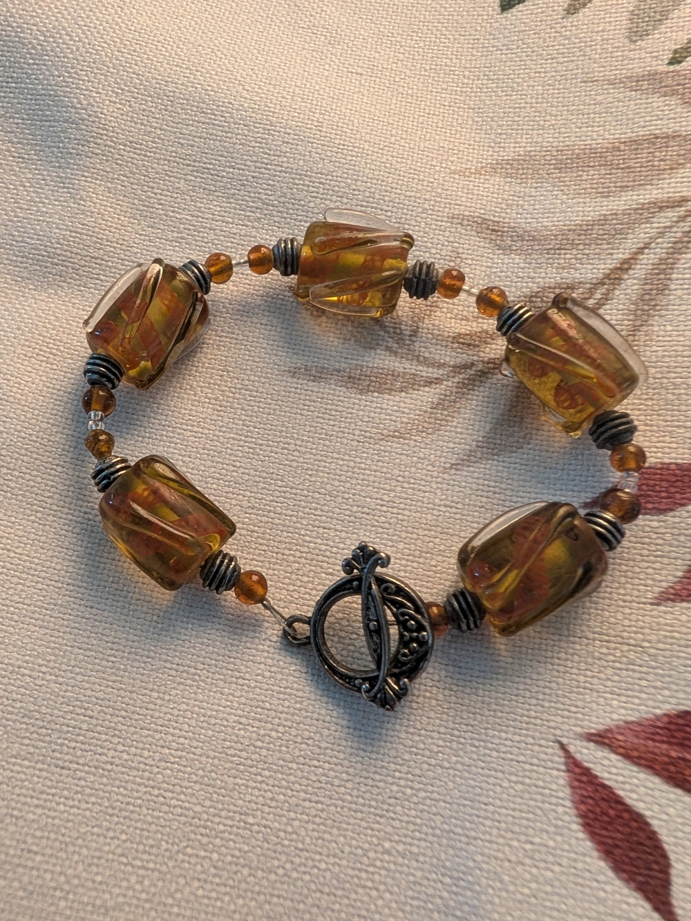 Hand Crafted Amber-Tone Glass Bead Bracelet with Silver Toggle